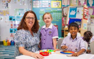 Kindergarten students work with their teacher at St Joseph's Catholic Primary School Rosebery.